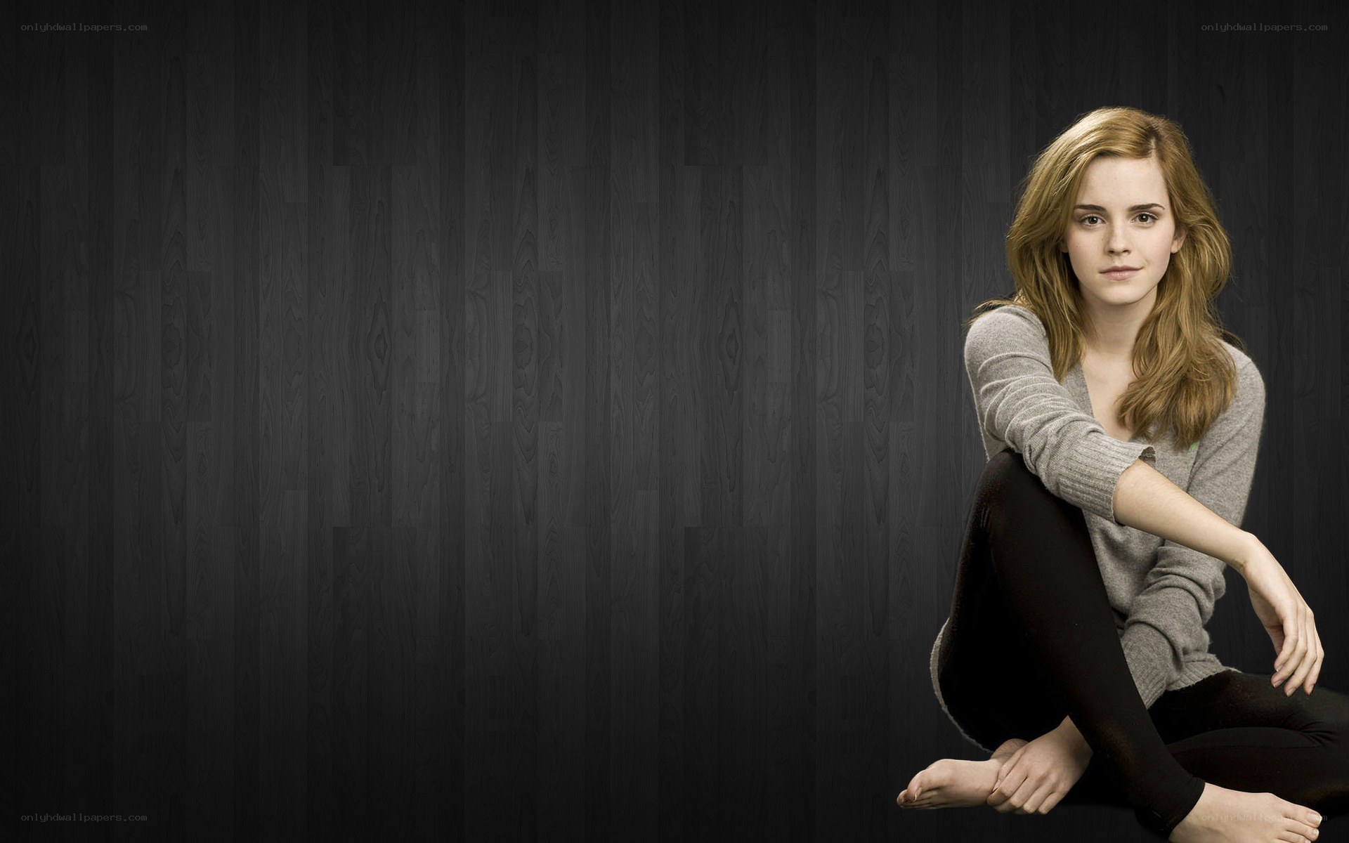 Emma Watson sitting on floor
