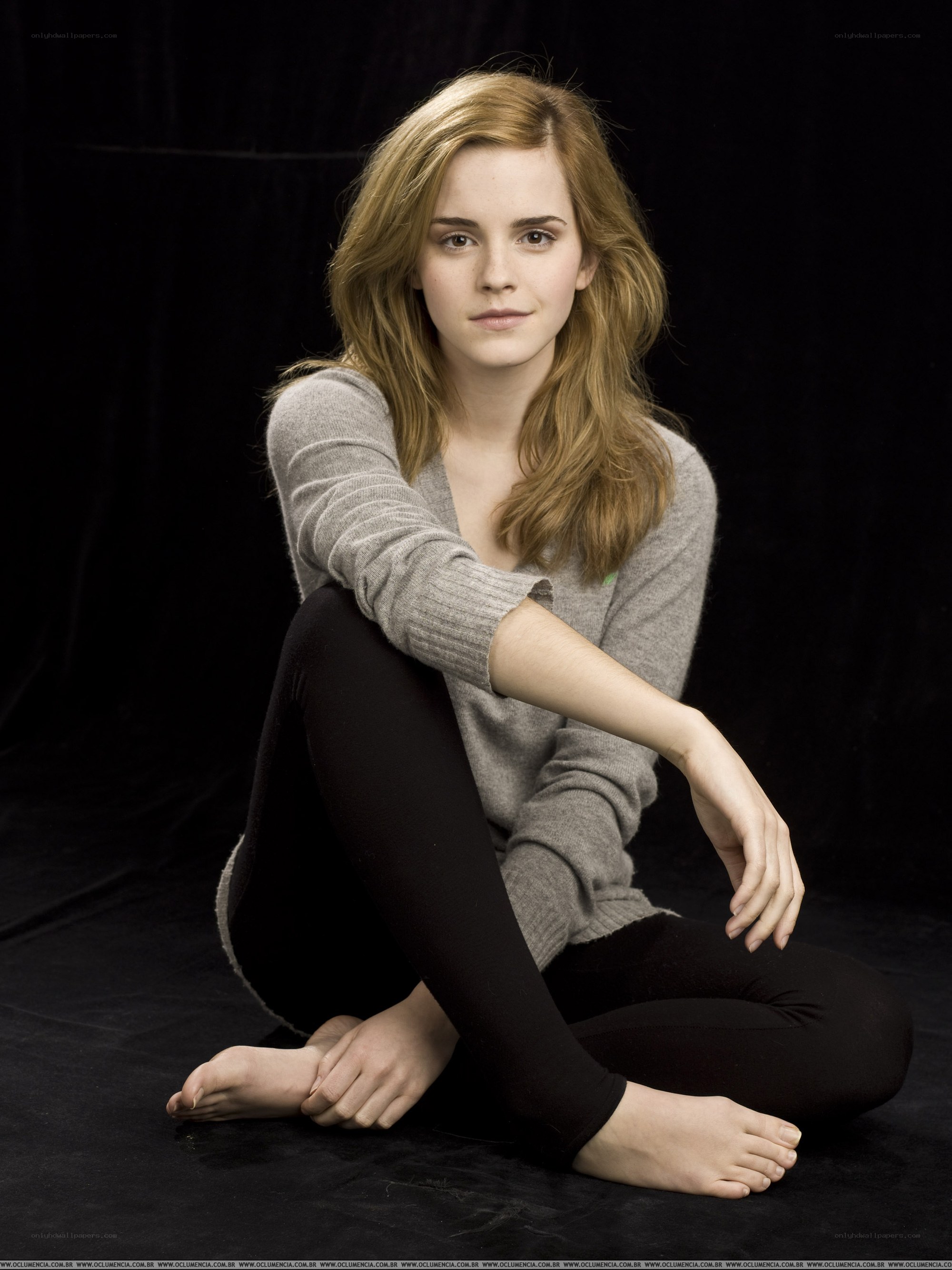 Emma Watson sitting on floor