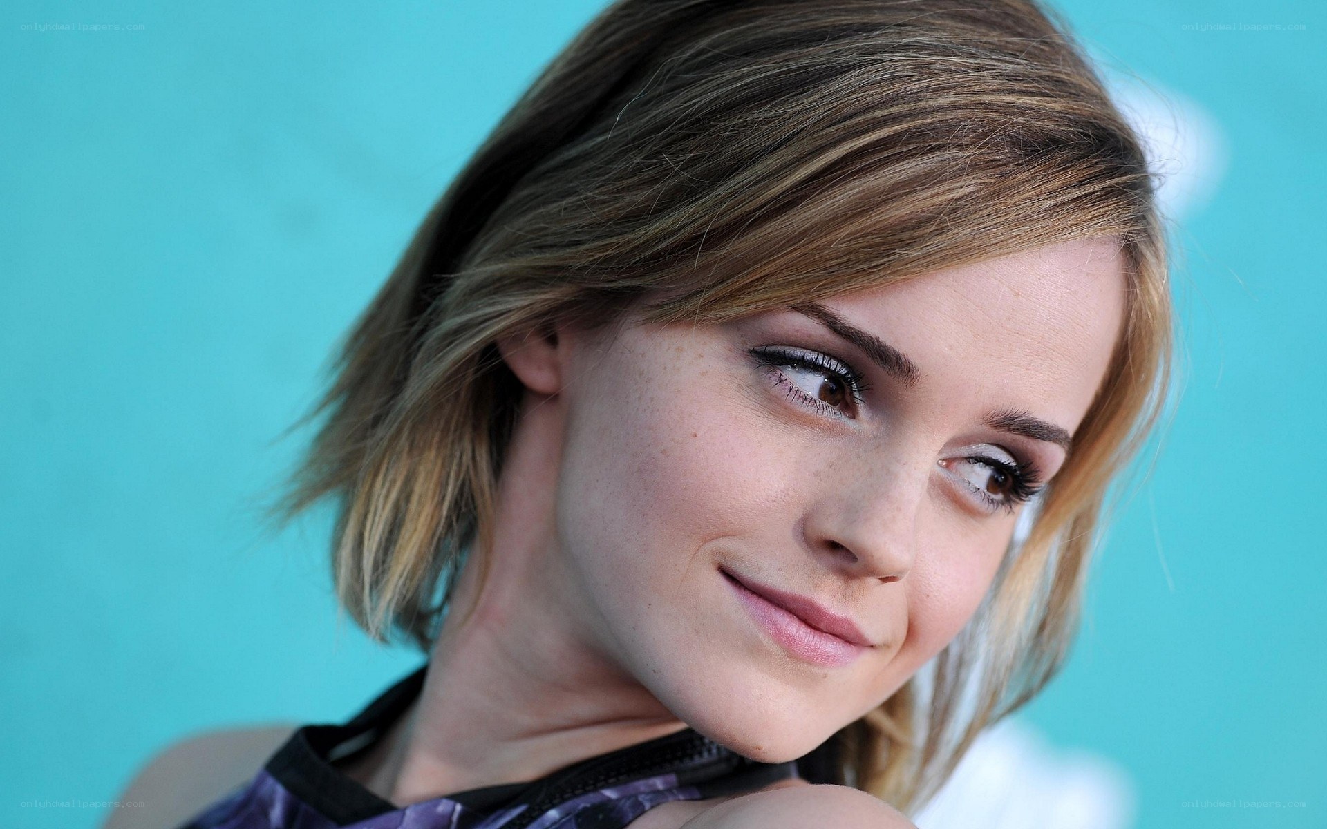 Emma Watson smiling at event