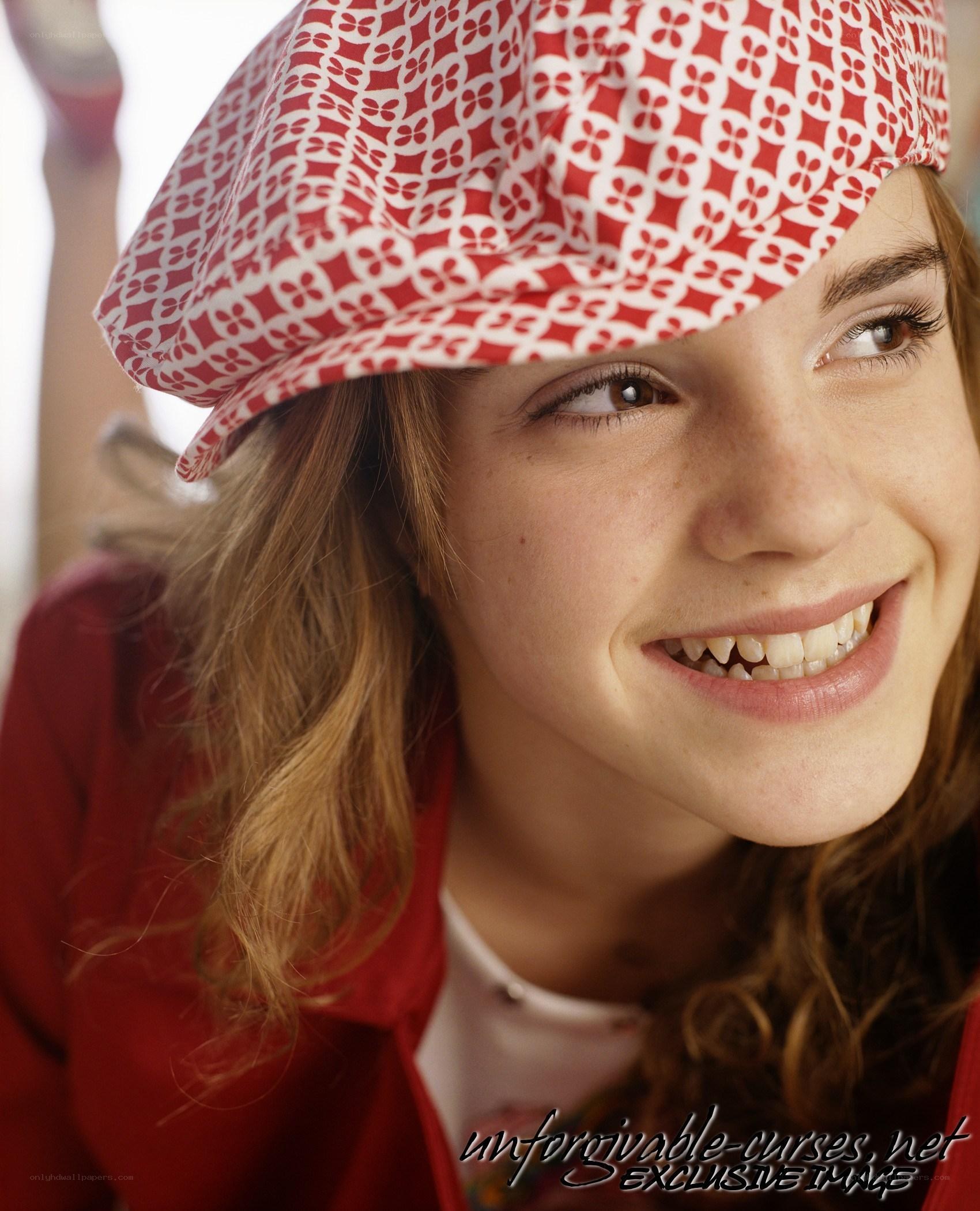 Emma Watson smiling in red hat