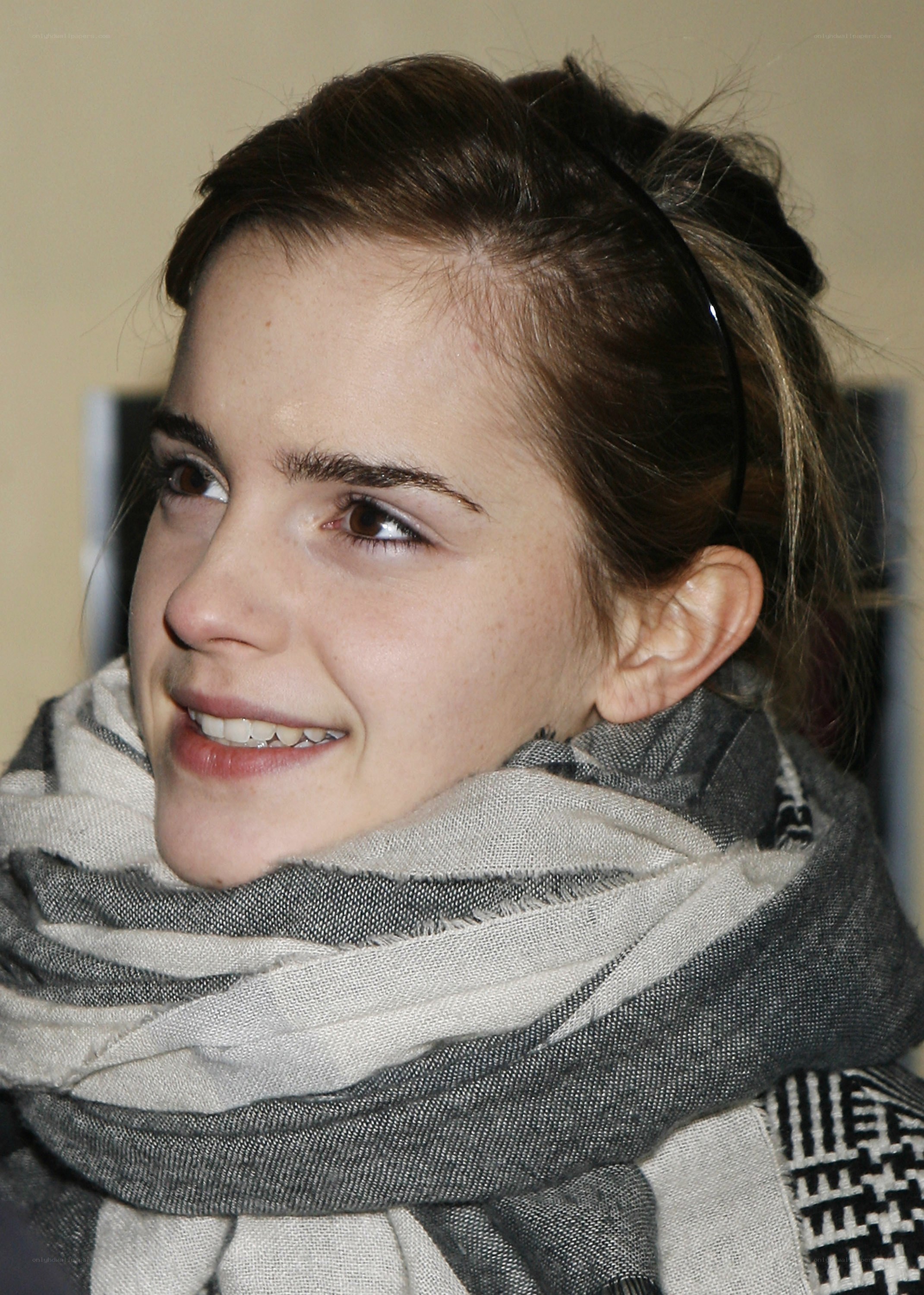 Emma Watson smiling in scarf