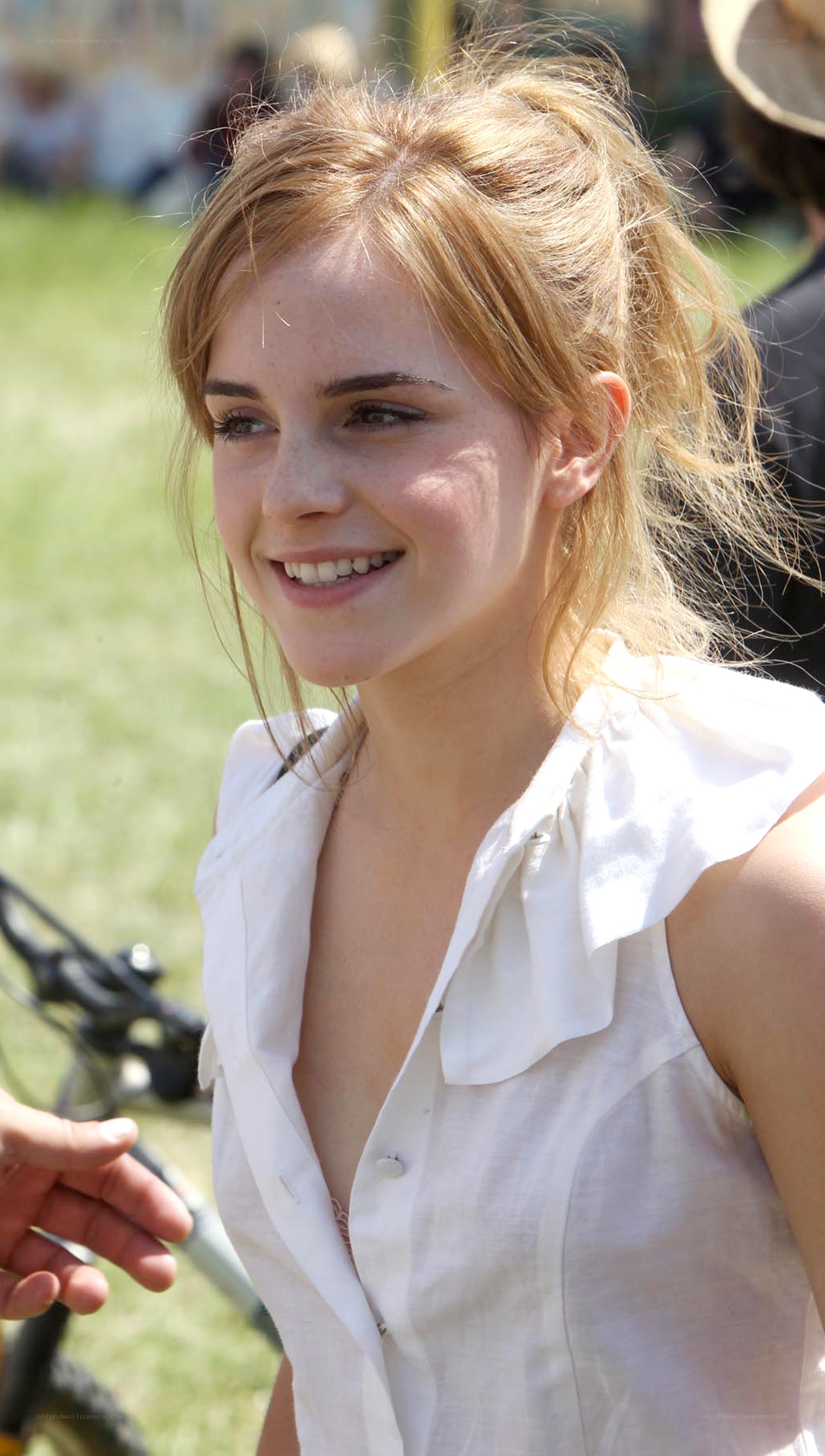 Emma Watson smiling outdoors