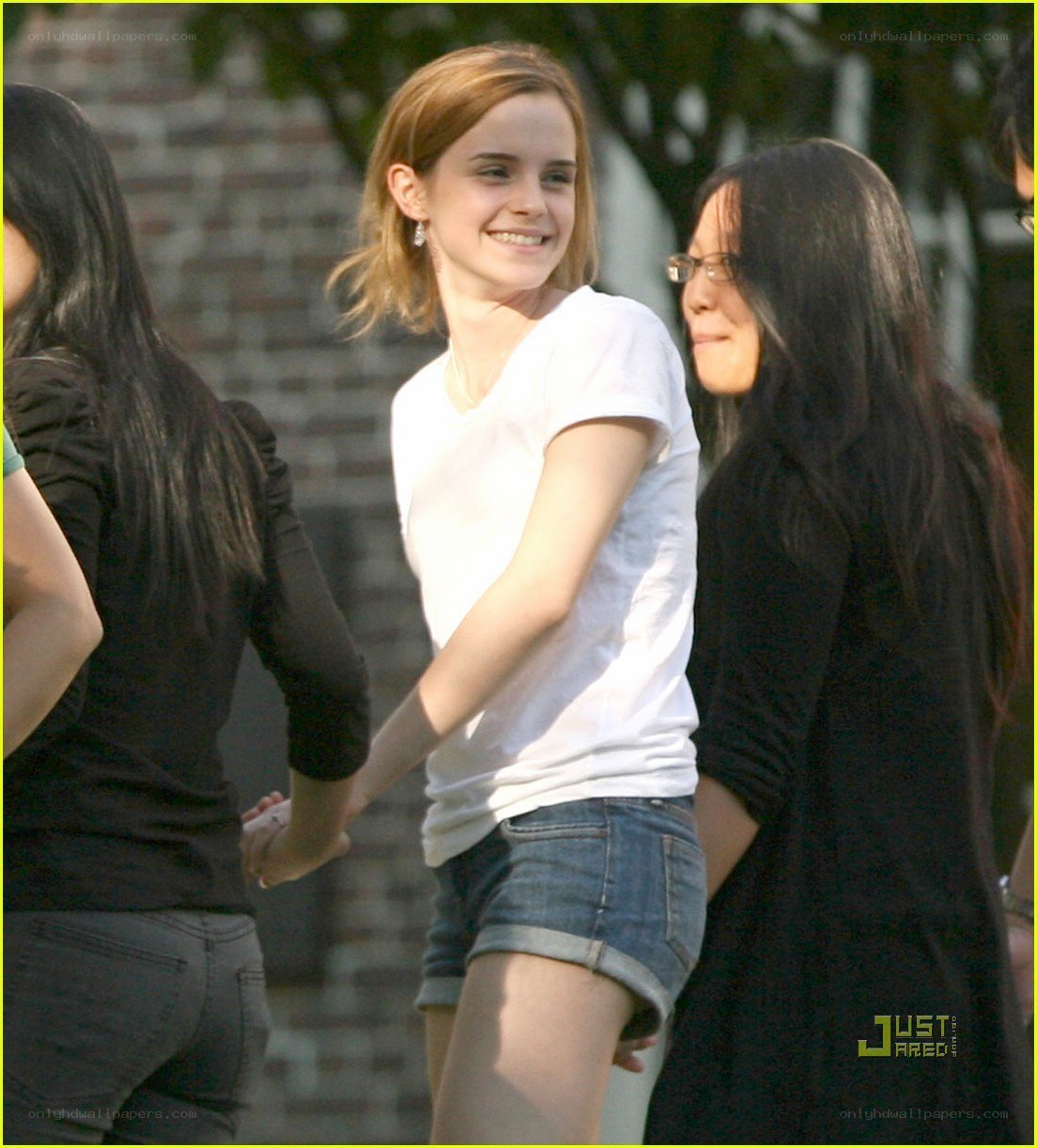 Emma Watson smiling with friends