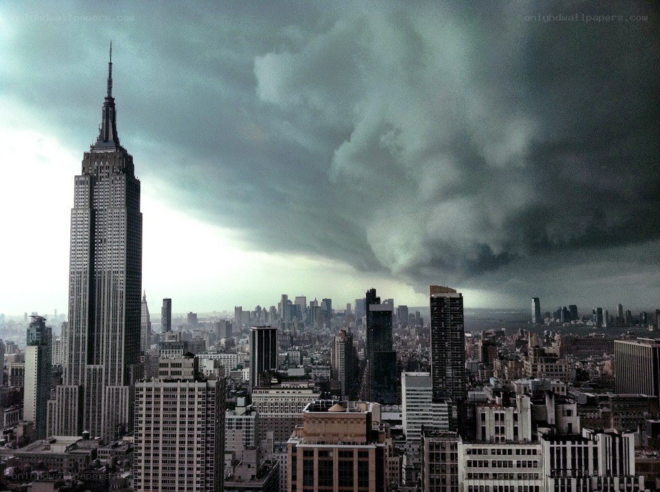 Empire State Building under storm clouds