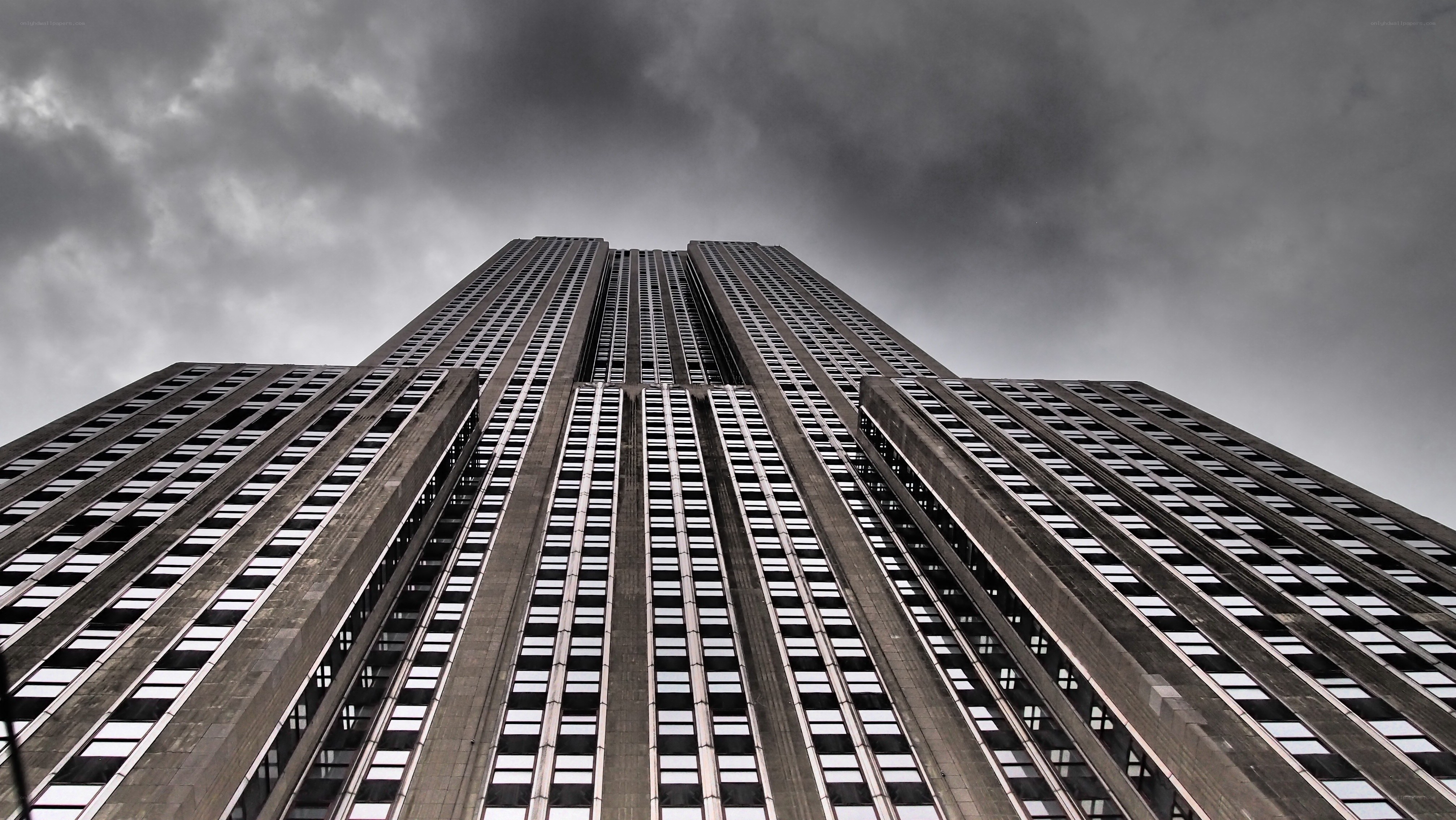 Empire State Building under stormy sky