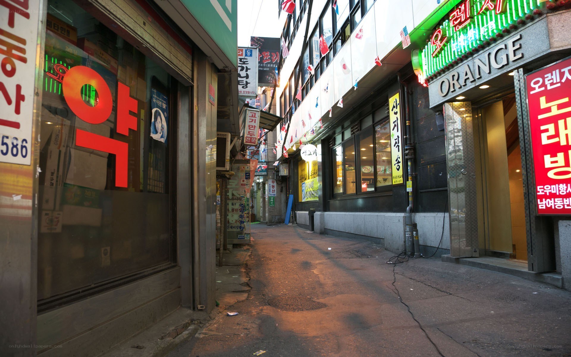 Empty alley with Korean storefronts
