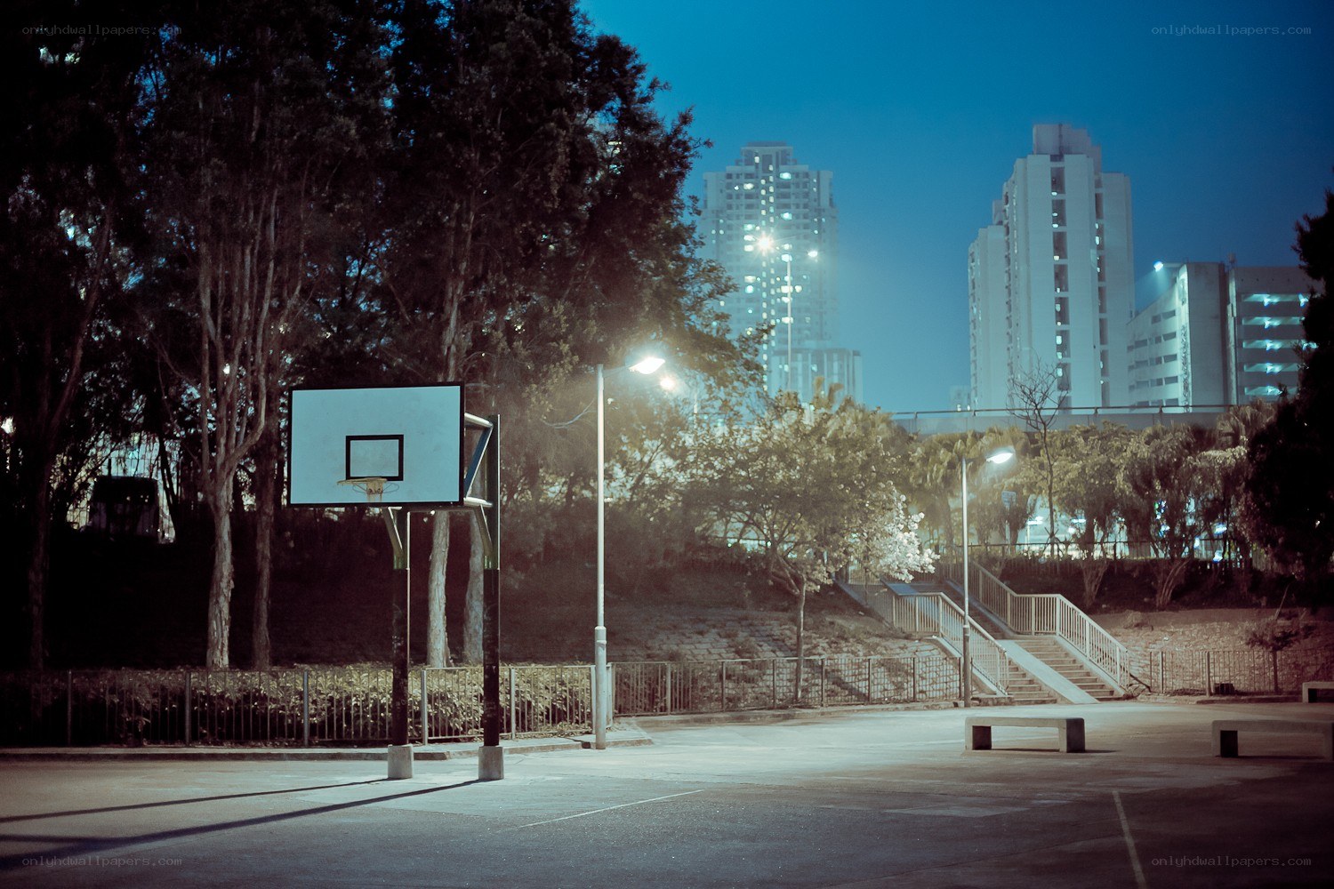 Empty basketball court at night