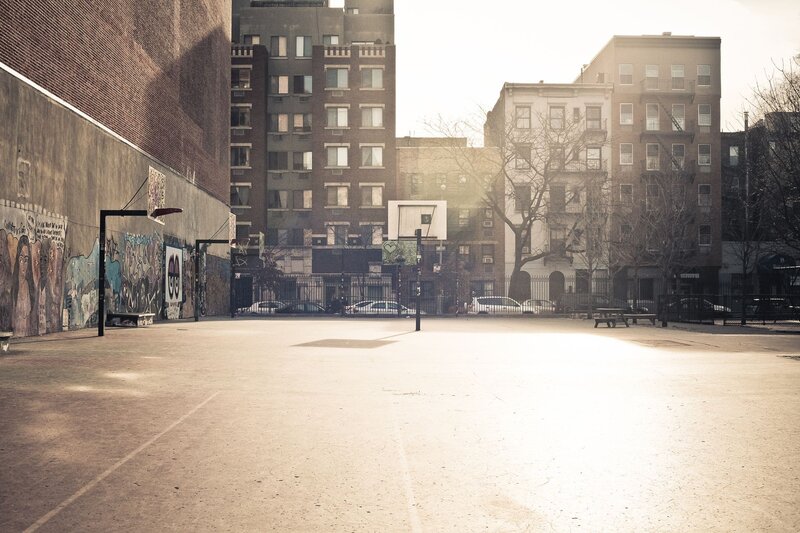 Empty basketball court in urban area