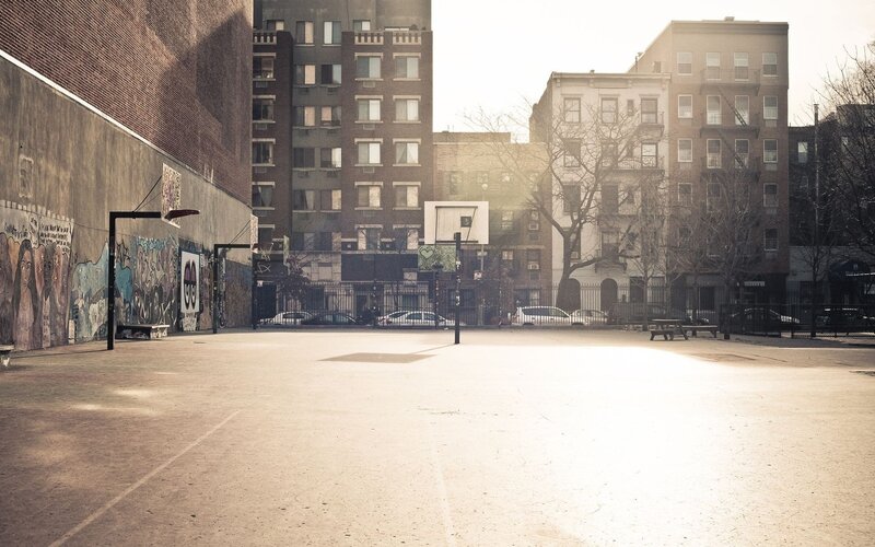 Empty basketball court in urban area