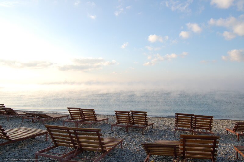 Empty beach chairs at dawn