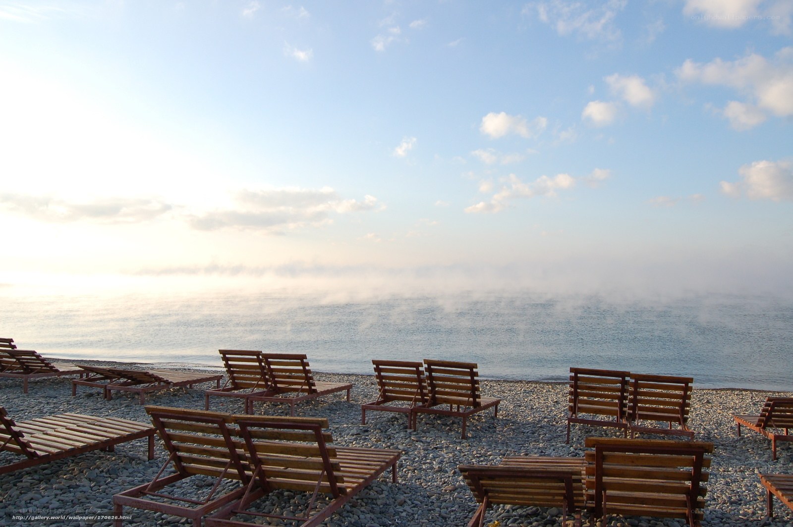 Empty beach chairs at dawn