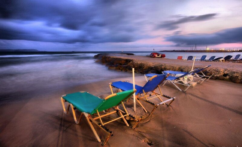 Empty beach chairs at dusk
