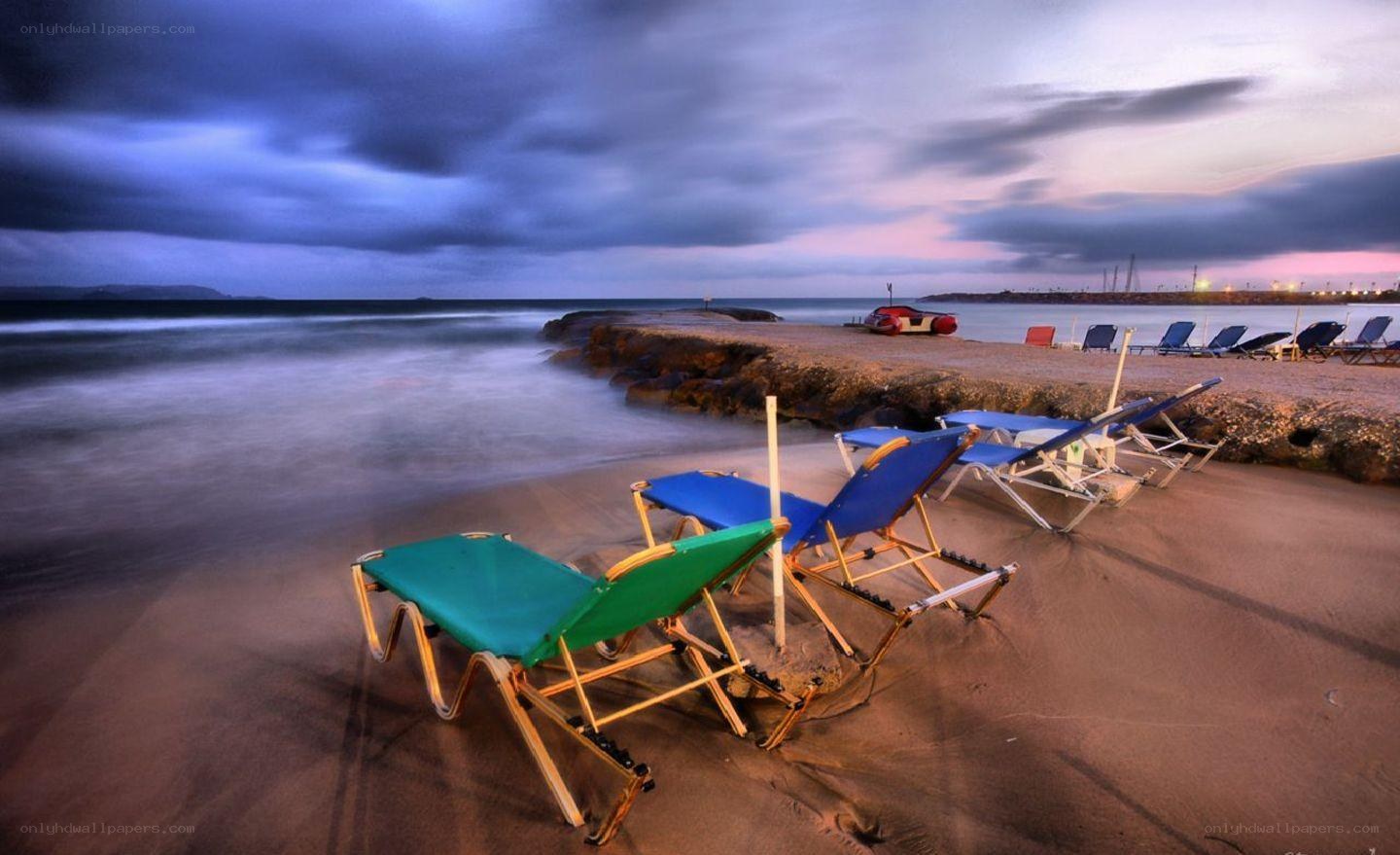 Empty beach chairs at dusk