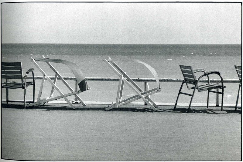 Empty beach chairs by the sea