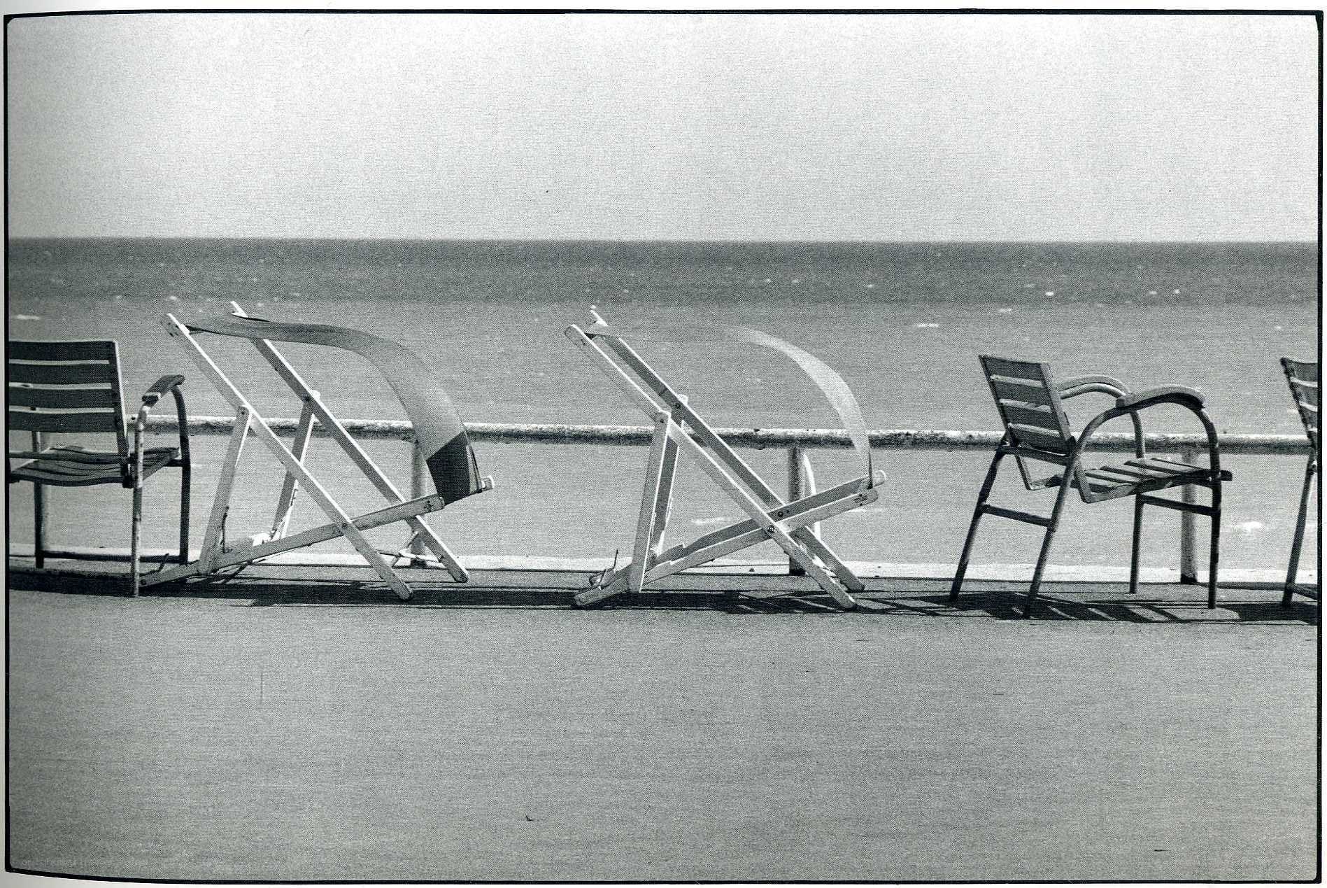 Empty beach chairs by the sea