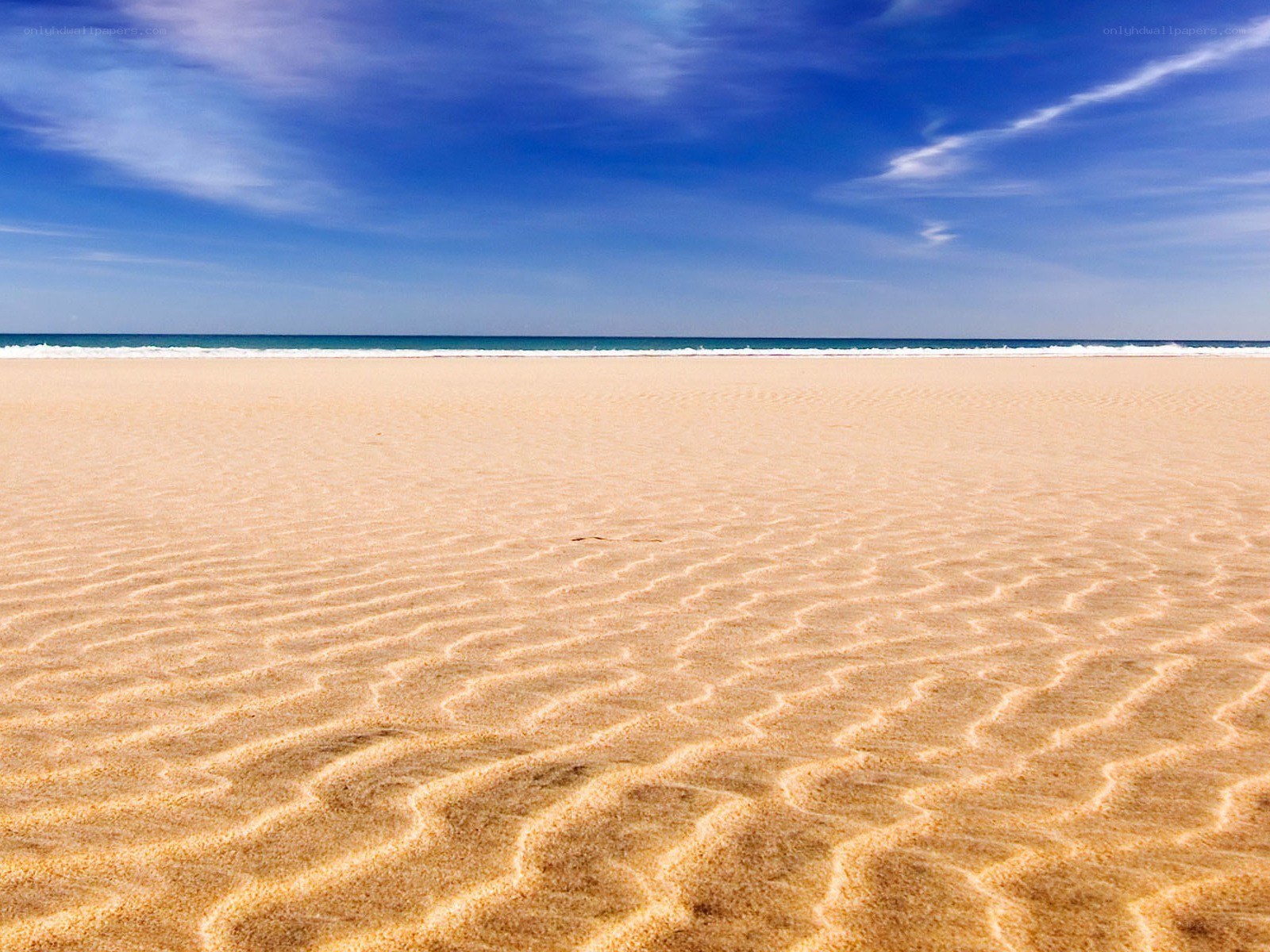 Empty beach with rippled sand