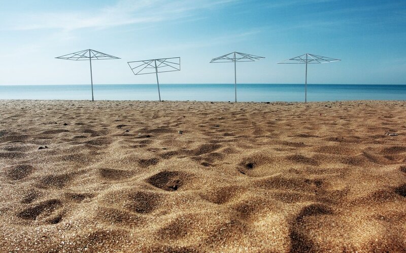 Empty Beach with Umbrellas — Blue