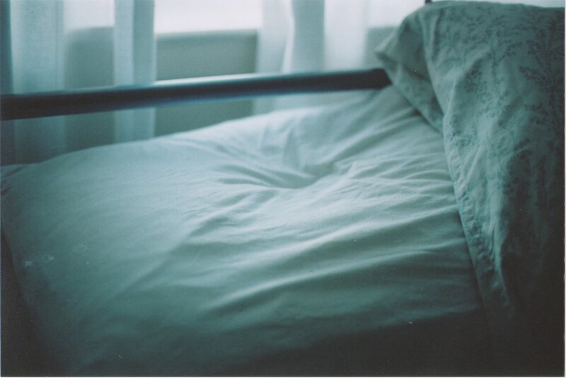 empty bed in soft light