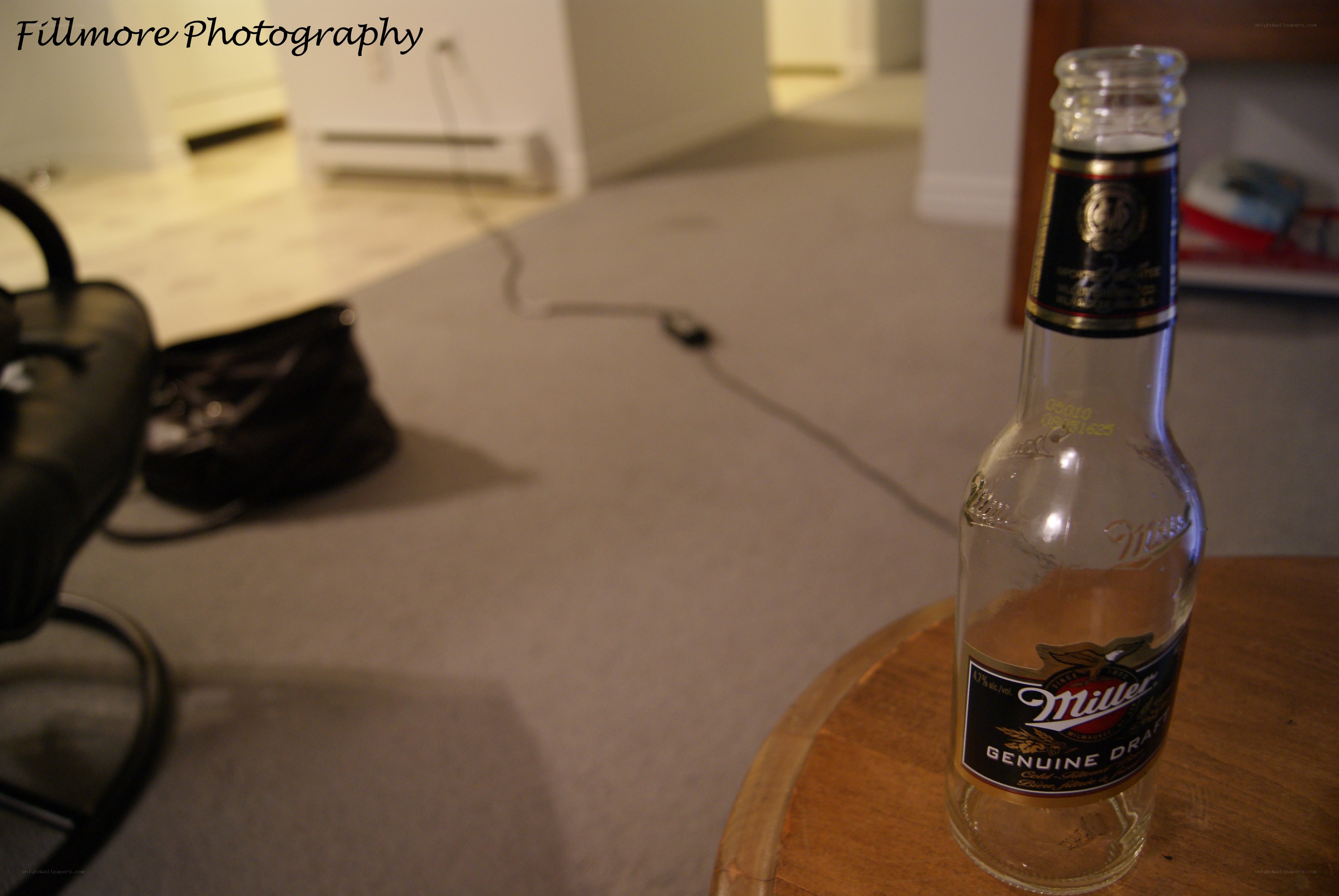 Empty beer bottle on table