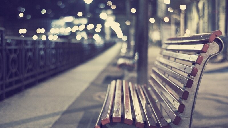 Empty bench at night