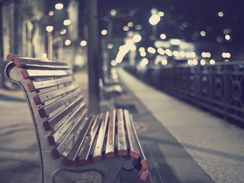 Empty bench at night