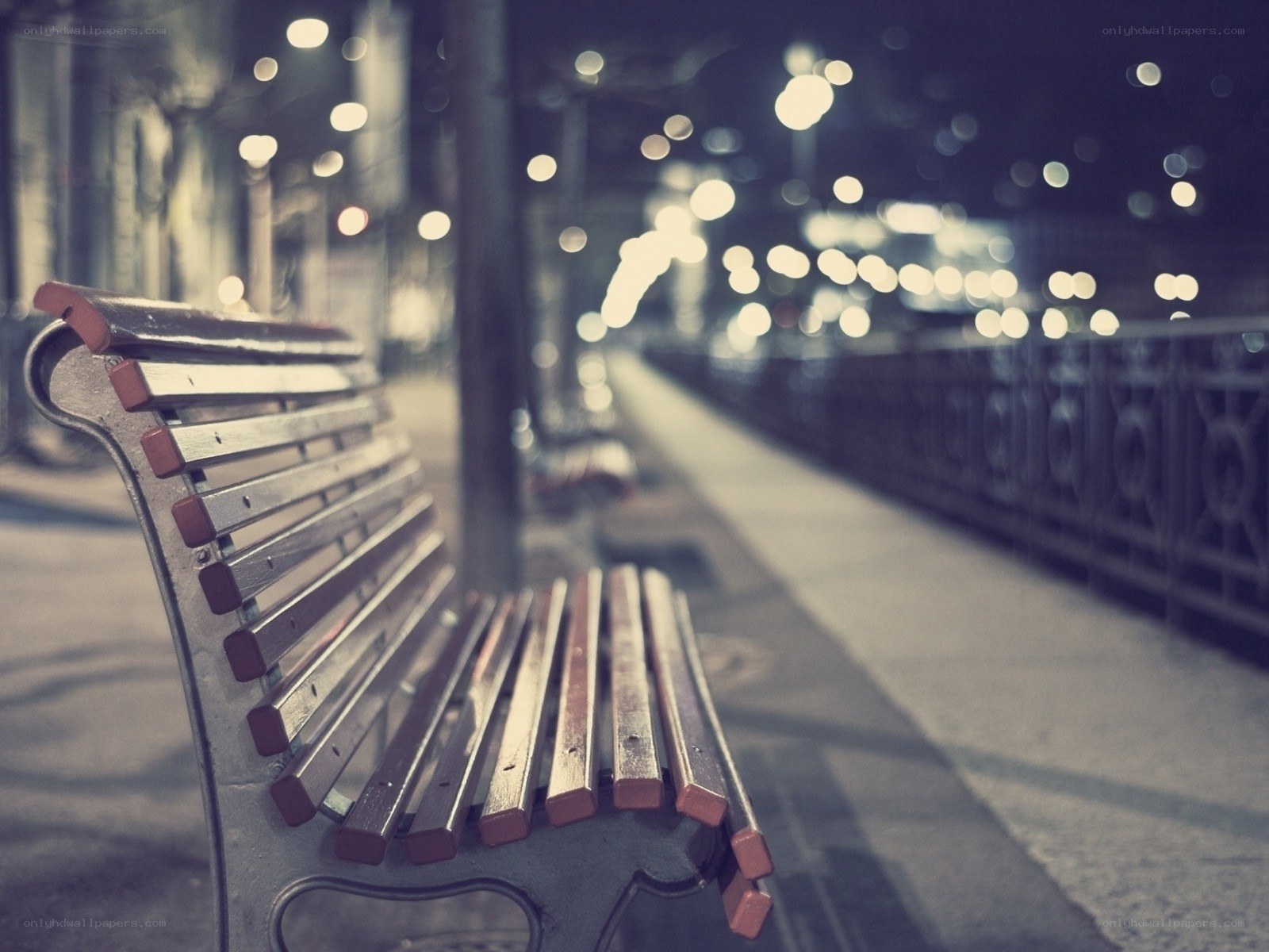 Empty bench at night