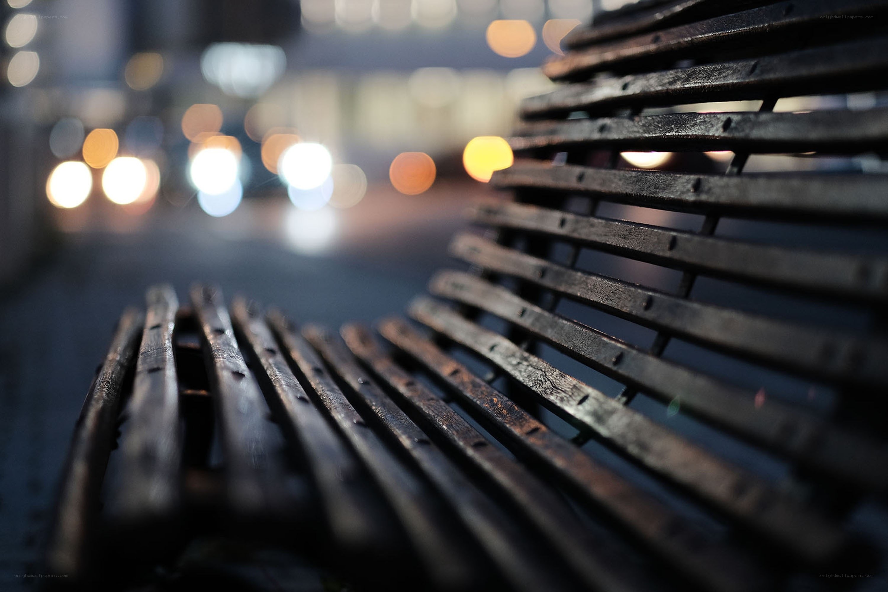 Empty bench at night