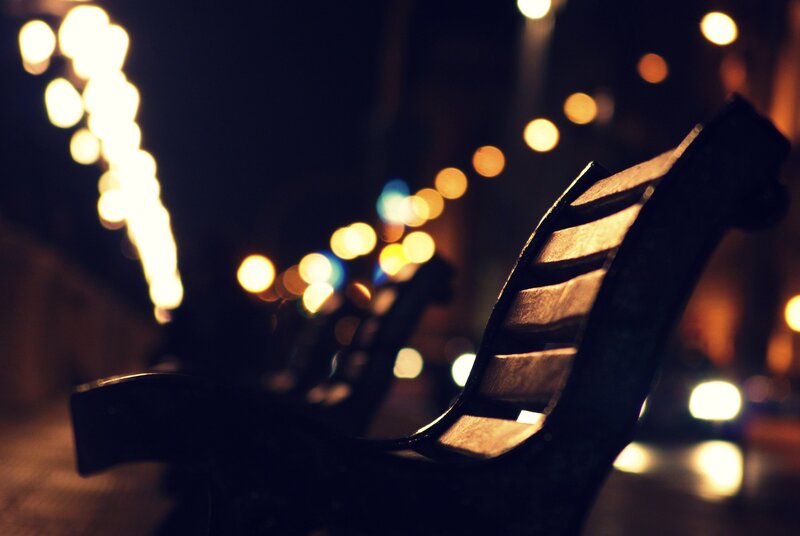 Empty bench at night