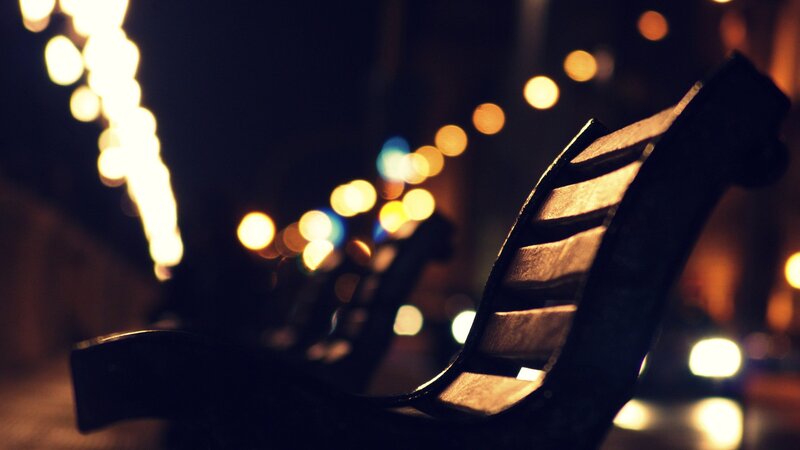 Empty bench at night
