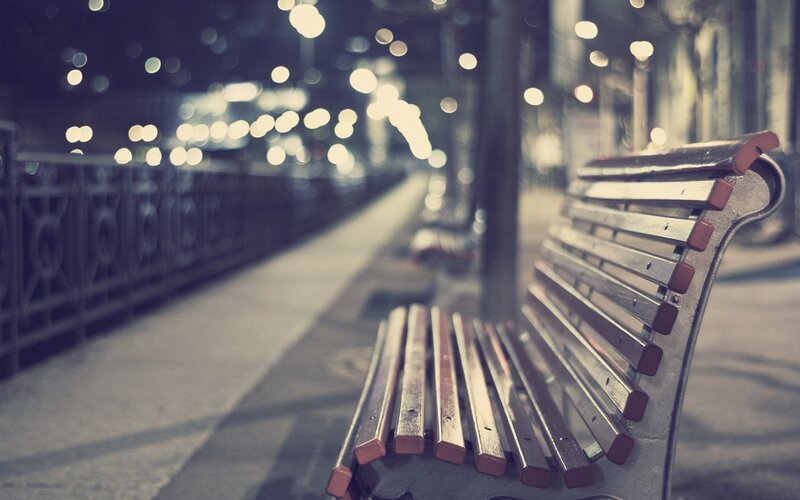 Empty bench at night