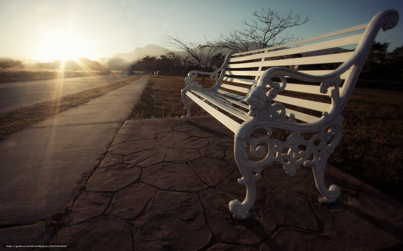 Empty bench at sunrise