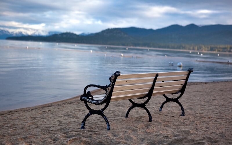 Empty Bench on Beach — Brown, Serene