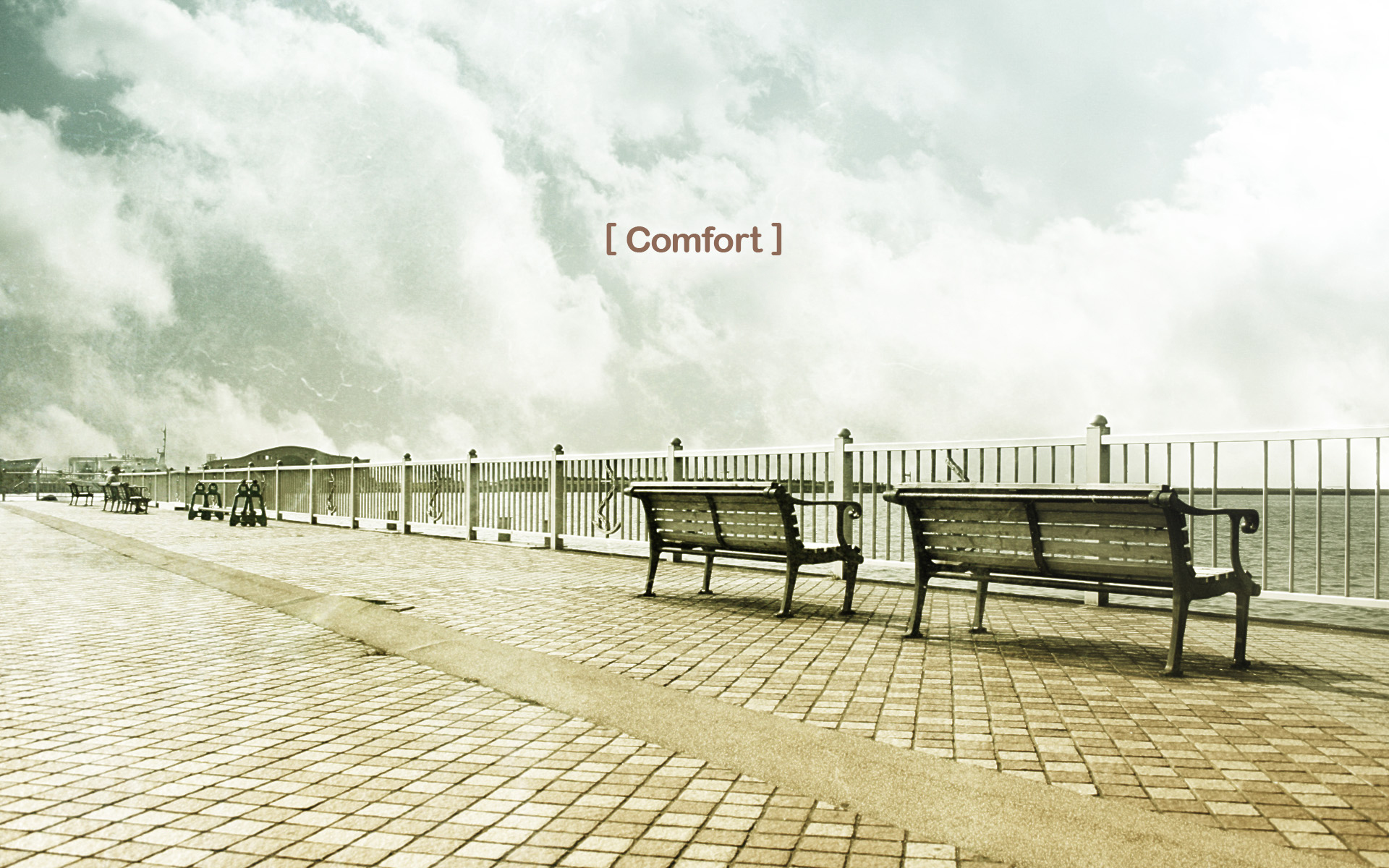Empty benches by the sea