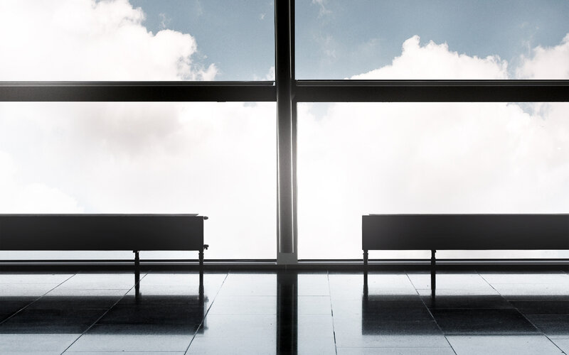 Empty benches by the window
