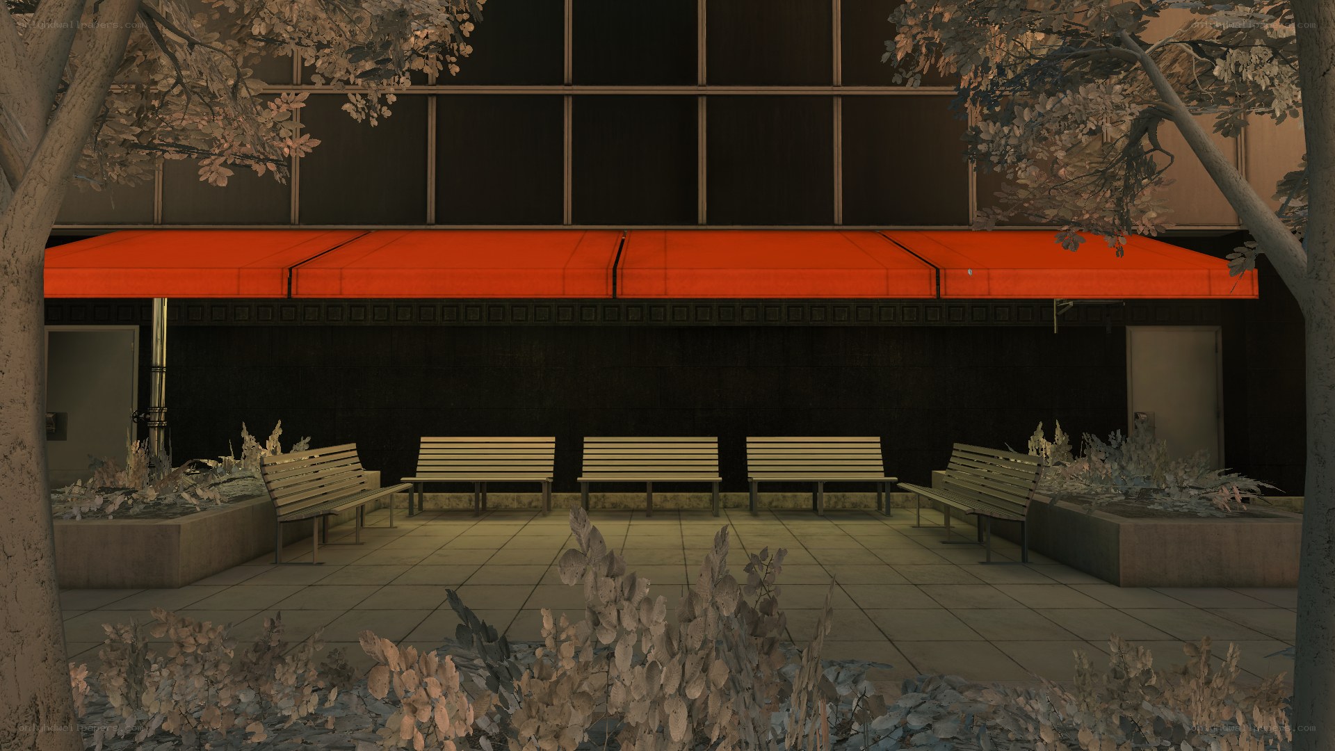 Empty benches under red awning
