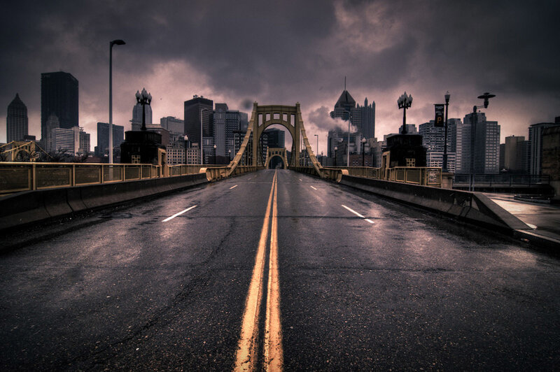 Empty bridge to city skyline