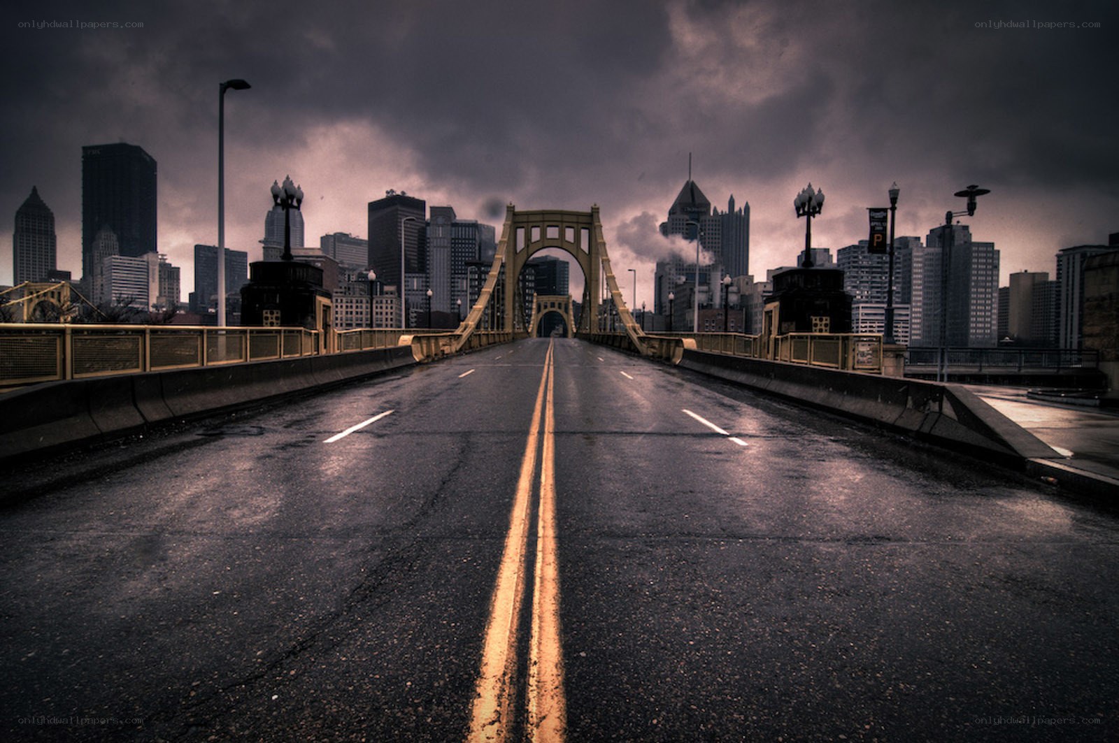 Empty bridge to city skyline