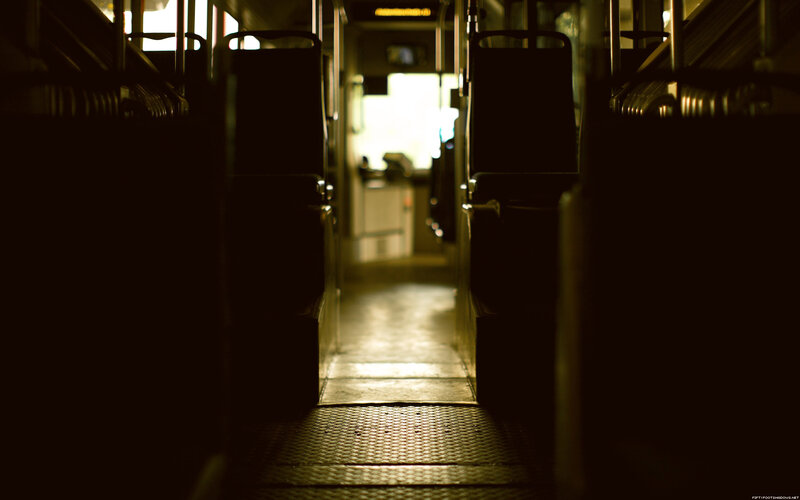 Empty bus aisle at night