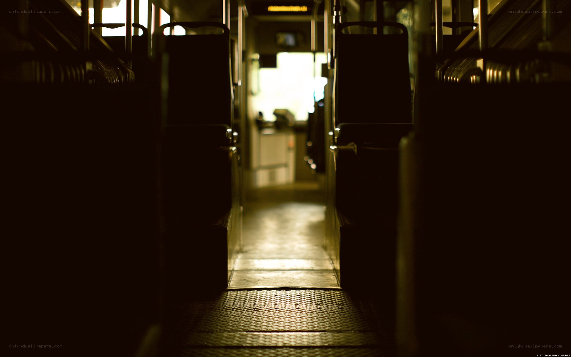 Empty bus aisle at night