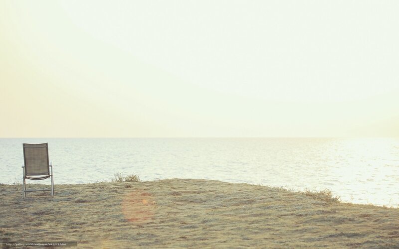 Empty chair by the sea