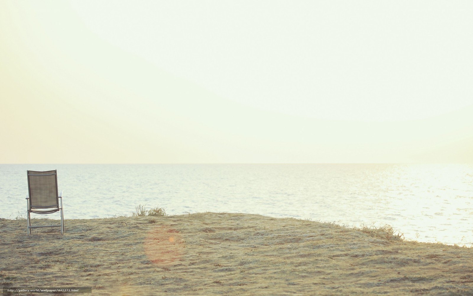 Empty chair by the sea