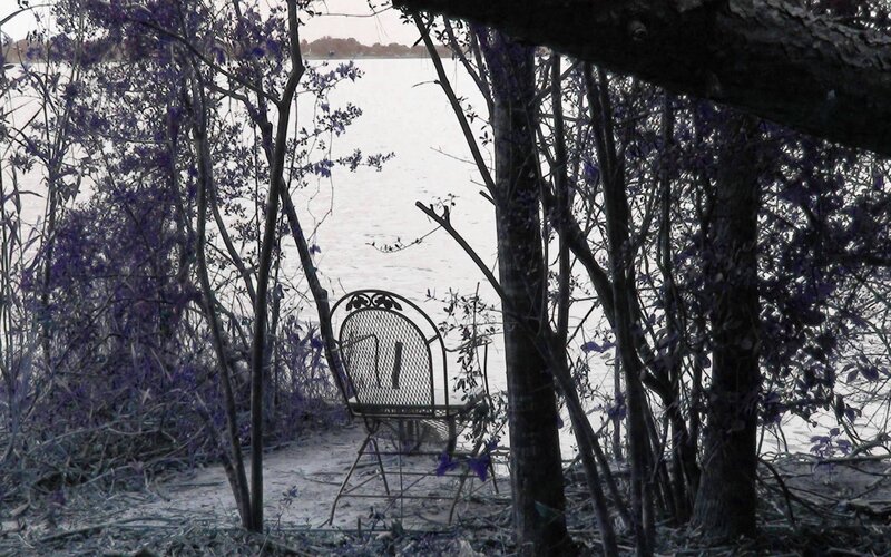 Empty Chair by Water