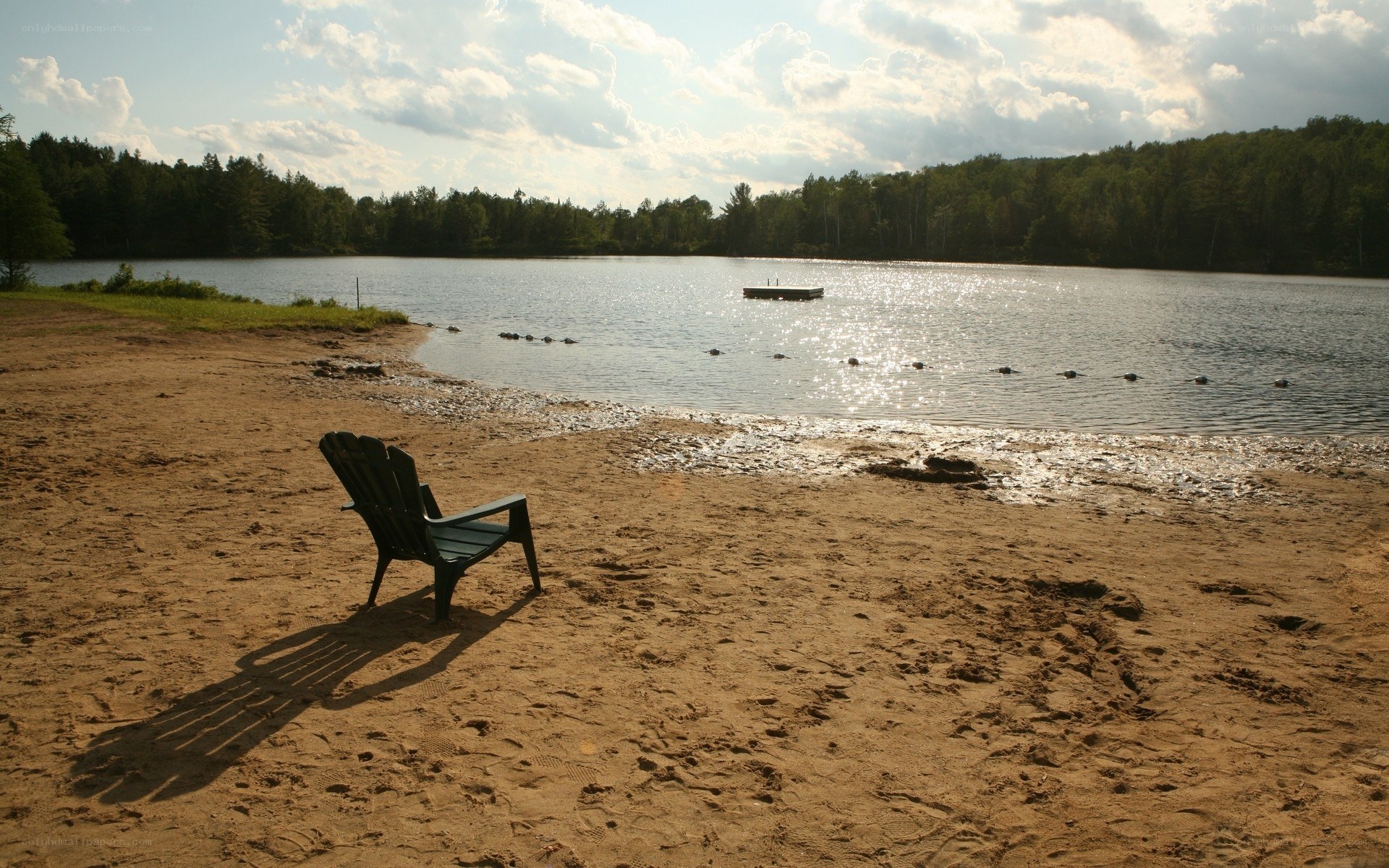 Empty chair on sandy beach