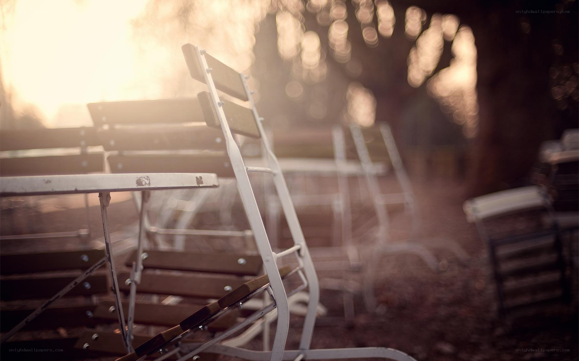 Empty chairs in golden light