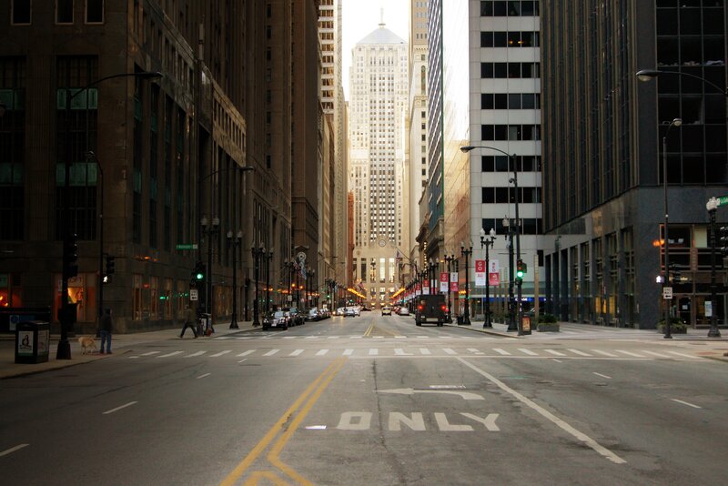 Empty city street with skyscraper
