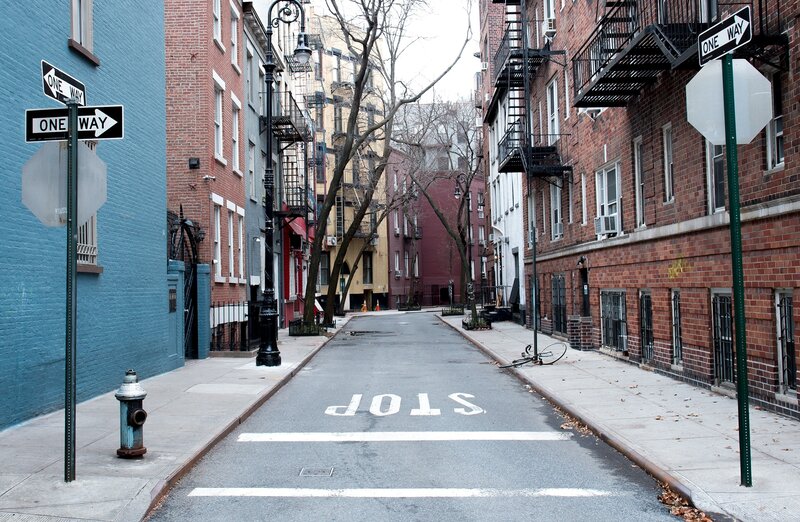 Empty city street with stop sign