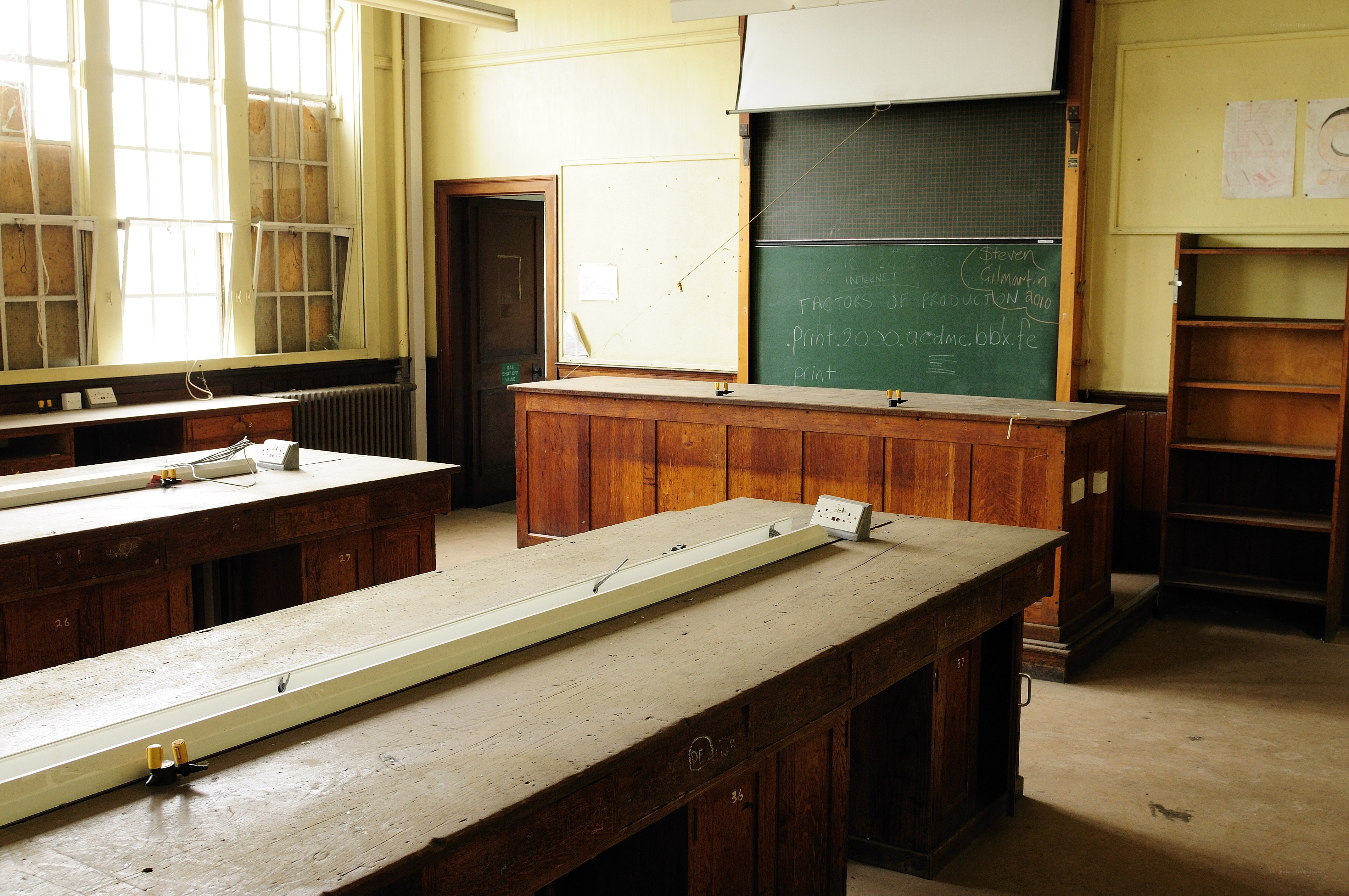 Empty classroom with wooden desks