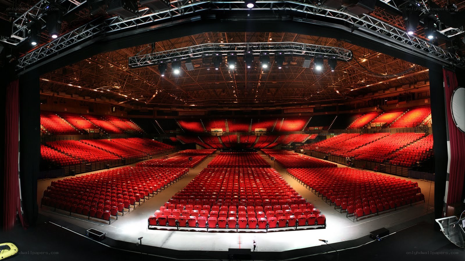 Empty concert hall with red seats