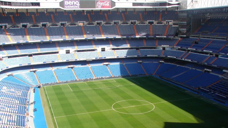 Empty Football Stadium — Blue, Serene, Afternoon, Photograph, Green Pitch