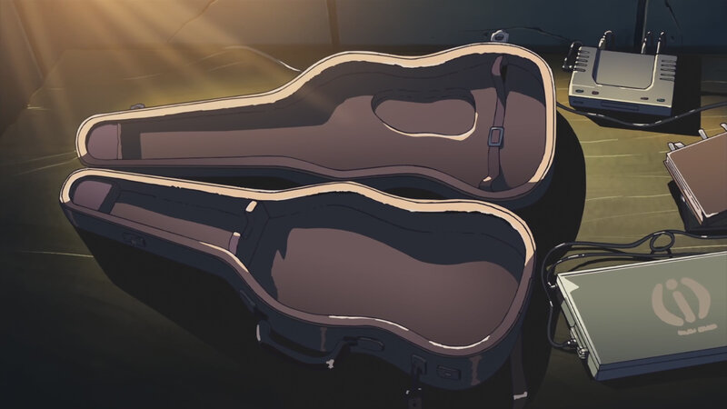 Empty guitar case in dim light